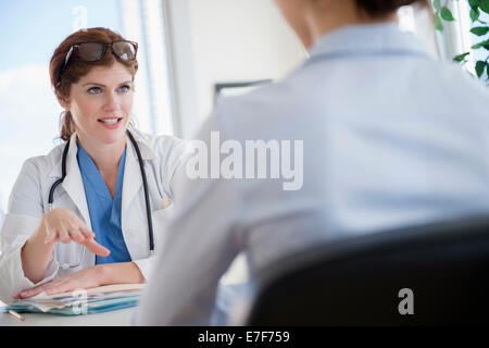 Doctor and patient talking in office Stock Photo
