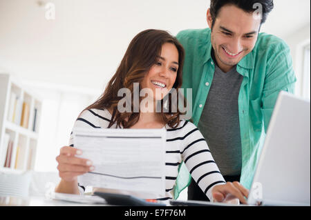 Couple paying bills together online