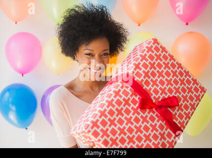 Woman Holding Gift Stock Photo - Alamy