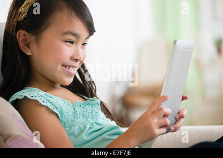 Filipino girl using tablet computer Stock Photo