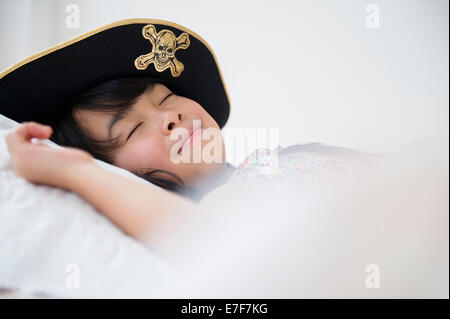 Filipino girl sleeping in dress-up costume Stock Photo