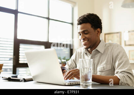 Black businessman working at desk Stock Photo