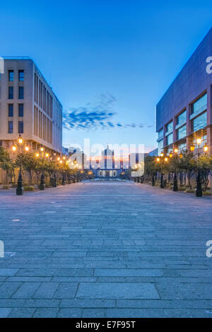 Illuminated street lamps on city street at dusk, Guadalajara, Jalisco, Mexico Stock Photo