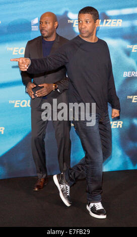 Berlin, Germany. 16th Sep, 2014. US actor and film director Antoine Fuqua (L) and US actor Denzel Washington pose during the presentation of the film 'The Equalizer' in Berlin, Germany, 16 September 2014. The film will come to German cinemas on 09 October 2014. Photo: JOERG CARSTENSEN/DPA/Alamy Live News Stock Photo