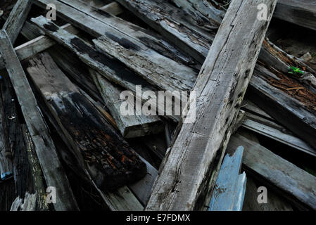 Grunge, heap of old grey decaying wood planks, pile of rubble, weathered timber, abstract, backgrounds, close-up, detail, still life Stock Photo