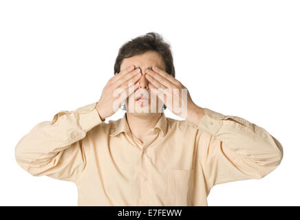 A man covering his eyes with his hands Stock Photo
