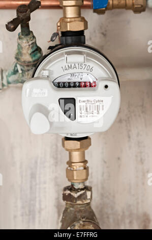 a water meter under a domestic sink with moldy walls the uk these meters have radio signals for collecting readings for Severn Stock Photo