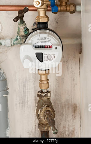 a water meter under a domestic sink with moldy walls the uk these meters have radio signals for collecting readings for Severn Stock Photo