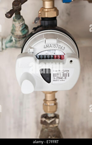 a water meter under a domestic sink with moldy walls the uk these meters have radio signals for collecting readings for Severn Stock Photo