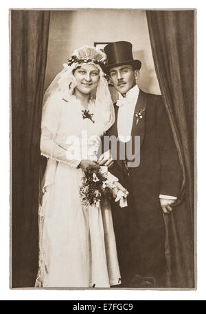 BERLIN, GERMANY - CIRCA 1930: antique wedding photo. portrait of just married couple. nostalgic picture with original scratches Stock Photo