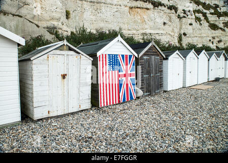 English beech hut with Union Jack and Stars and stripes painted on the front Stock Photo