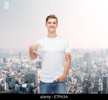 smiling young man in blank white t-shirt Stock Photo