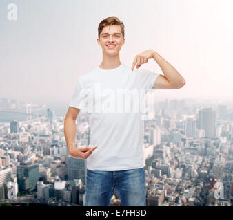 smiling young man in blank white t-shirt Stock Photo