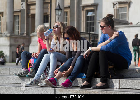 London, UK. 16th September, 2014. UK Weather.  Londoners enjoy a warm and sunny day  in Trafalgar Square as temperatures rise in London Credit:  amer ghazzal/Alamy Live News Stock Photo