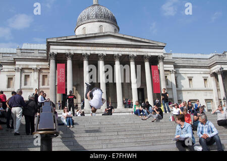 London UK. 16th September 2014. A man performs acrobatics on the steps of  Trafalgar Square on a warm sunny day  as Londoners enjoy rising temperatures  in London Credit:  amer ghazzal/Alamy Live News Stock Photo