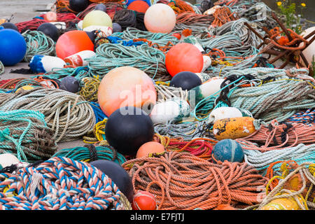 Fishing ropes and equipment during the day on the floor Stock Photo