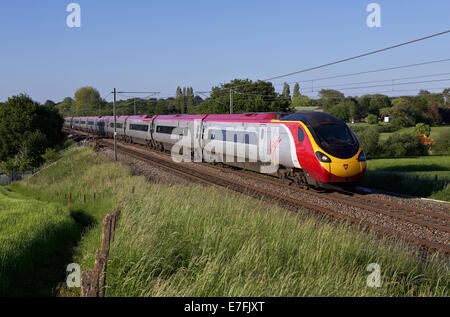Virgin Trains West Coast Pendolino speeds south with a Glasgow - Euston service on 19/06/13.