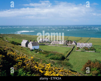 Methodist chapel & mission house, abbey ruins, semi-detached model farmhouses, gardens & stockyards seen from Mynydd Enlli, Bardsey Island, N. Wales. Stock Photo