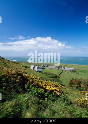 Methodist chapel & mission house, abbey ruins, semi-detached model farmhouses, gardens & stockyards seen from Mynydd Enlli, Bardsey Island, N. Wales. Stock Photo