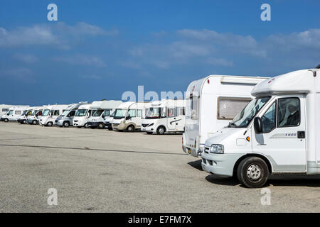 Row of motorhomes parked in car park for RVs / recreational vehicle Stock Photo