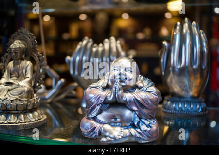 Silver buddha souvenir and hand seller in the shops of Old Town, Shanghai. Jing'an Temple is a famous Esoteric Buddhist temple i Stock Photo