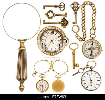 collection of golden vintage accessories, jewelry and objects. antique keys, clock, loupe, compass, glasses isolated on white ba Stock Photo