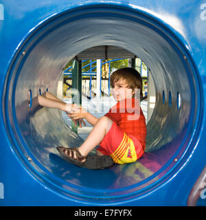 Toddler Holding His Mother's Hands while Playing in Tunnel on Playground at Waterfront Park in Louisville Kentucky Stock Photo