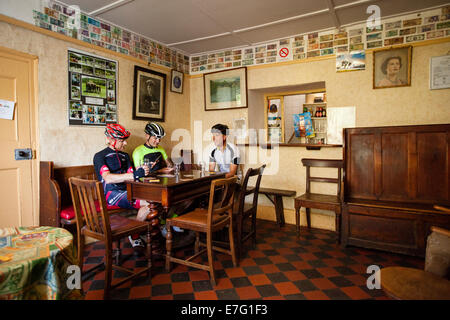 Three cyclists stop at a pub in Pembrokeshire, Wales Stock Photo