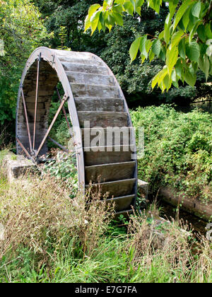 Old water wheel next to Helston boating lake, Cornwall, UK Stock Photo