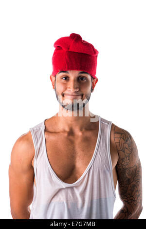 Portrait of handsome young man in funny red hat doing silly expression isolated on white Stock Photo