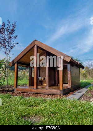 Wooden kennel in the backyard Stock Photo