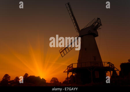 Sunset silhouette of Woodchurch windmill in Kent Stock Photo