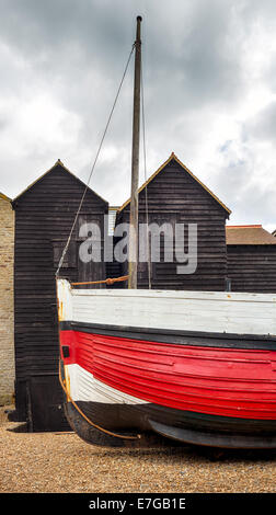 Tall thin traditional wooden fishing net huts at the Stade in Hastings, East Sussex Stock Photo