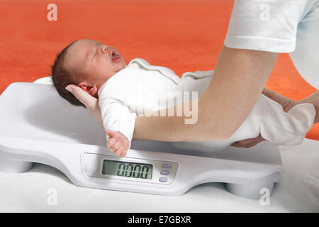 Baby boy birth weight on hospital scales Stock Photo - Alamy