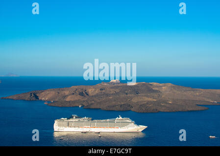 view at cruiseboat at Santorini island in Greece with the vulcanic new island Nea Kameni Stock Photo