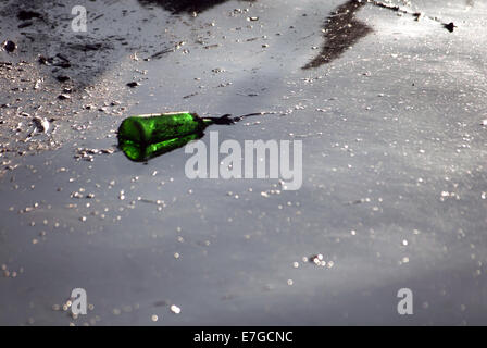 Discarded plastic bottle in canal / Rubbish Stock Photo