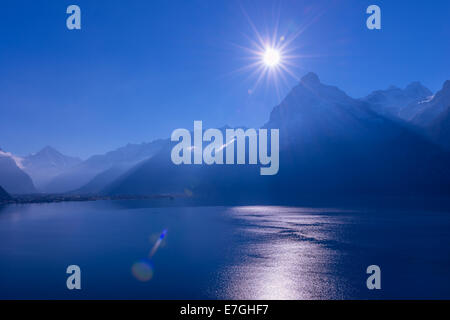 Panorama of mountains and lakе, a bird's-eye view. Lens Flare. Dark blue royal color Stock Photo