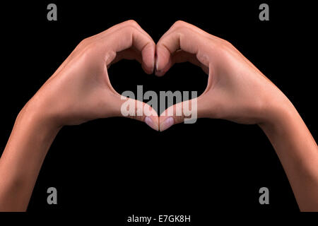 Girl hand in heart isolated on black background Stock Photo