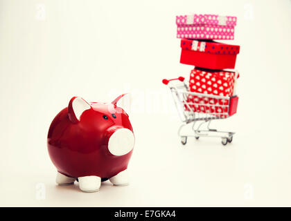 Shopping Cart and gift boxes with Red piggy bank Stock Photo
