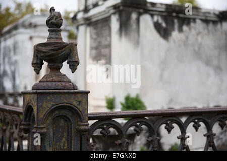 New Orleans Saint Louis Cemetery.  Old and rusty wrought iron corner post and fence.  Copy space in upper right if needed. Stock Photo