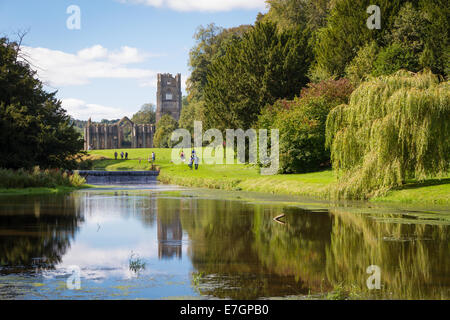 External of Fountains Abbey in Ripon, North Yorkshire with reflection in the water Stock Photo