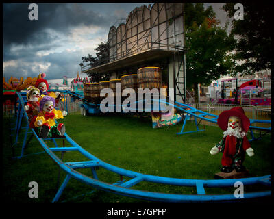 little clowns clowning around on train rails Stock Photo