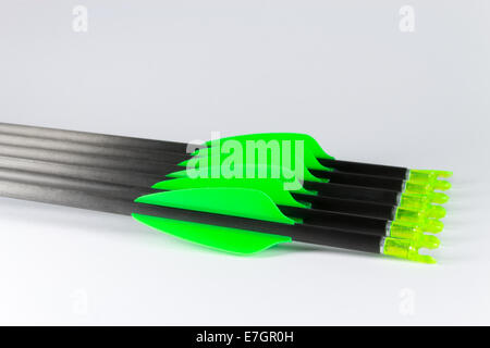 Thin competition target arrows for archery with green fletches. Stock Photo