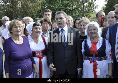 The Czech Republic is not planning any mass exodus of compatriots from Ukraine, said Foreign Minister Lubomir Zaoralek (centre) who arrived in Zhytomyr today, on Wednesday, September 17, 2014, to meet Volhynian Czechs and get acquainted with their situation. He said they can already now use a very simple way of permanently settling in the Czech Republic. Zaoralek brought with him over 100 kilograms of medical materiel destined for hospitals in eastern Ukraine. (CTK Photo/Filip Nerad) Stock Photo