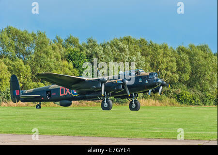 A restored Lancaster bomber 'Just Jane' taxiing at East Kirkby airfield, Lincolnshire Stock Photo