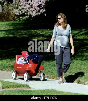 Heavily pregnant Jenna Fischer takes a morning stroll with son Weston, riding in a  Radio Flyer wagon, around Glendale. According to reports 'The Office' actress is due to give birth in late spring.  Featuring: Jenna Fischer,Weston Kirk Where: Glendale, California, United States When: 15 Mar 2014 Stock Photo