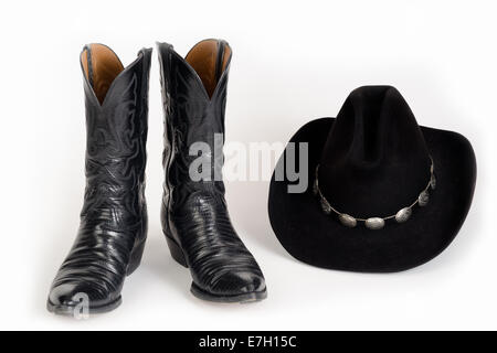 Black Cowboy Boots and Hat with Concho Hatband. Stock Photo