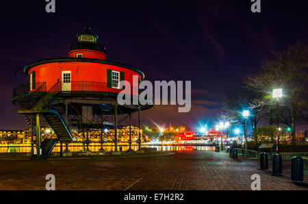 Seven Foot Knoll Lighthouse at night, in the Inner Harbor, Baltimore, Maryland. Stock Photo