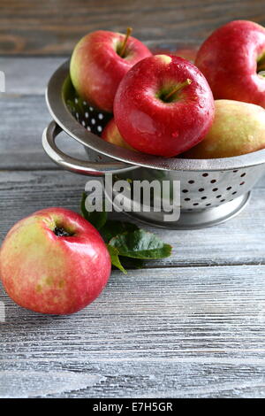 Sweet apples in in colander, healthy food Stock Photo