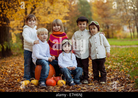 Autumn portrait of group of happy kids, outdoor in the park Stock Photo